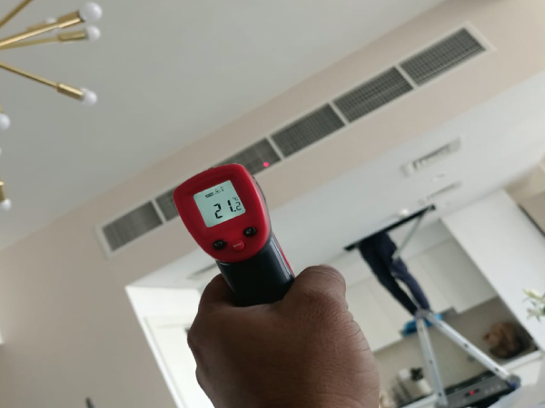 Certified technician servicing central AC and chiller cooling units in Dubai